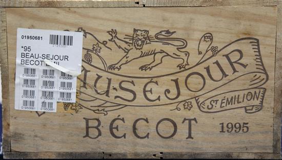 A case of twelve bottles of Chateau Beau-Sejour Becot, Saint Emilion, 1995, in original wooden case.